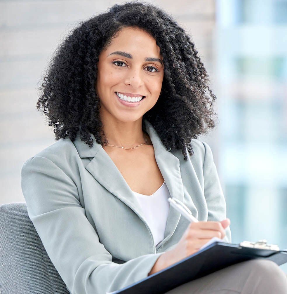 A mental health specialist sits with a client in a calm, supportive setting, listening attentively and providing guidance during a counseling session focused on emotional well-being.